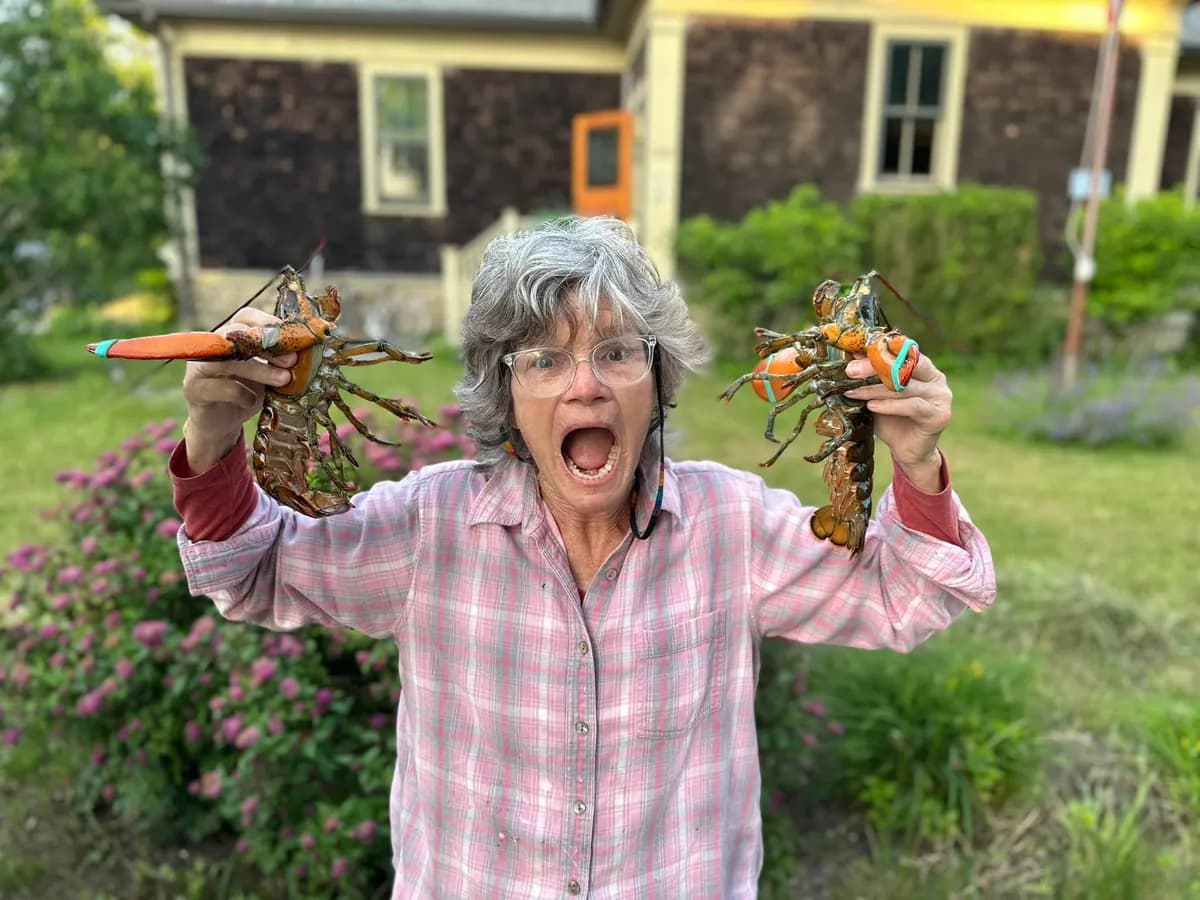Carol with two lobsters at Westport Point