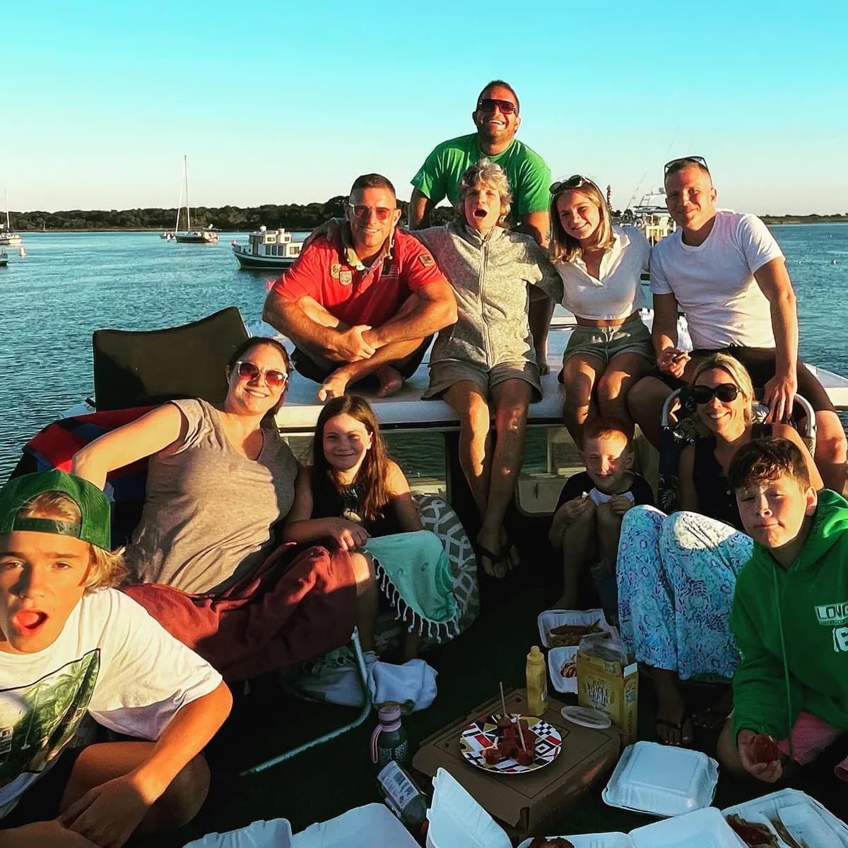 The Long family on the water at golden hour, Westport Harbor